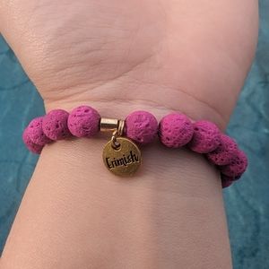 Fuchsia lava rock Erimish bracelet with black chain accent.